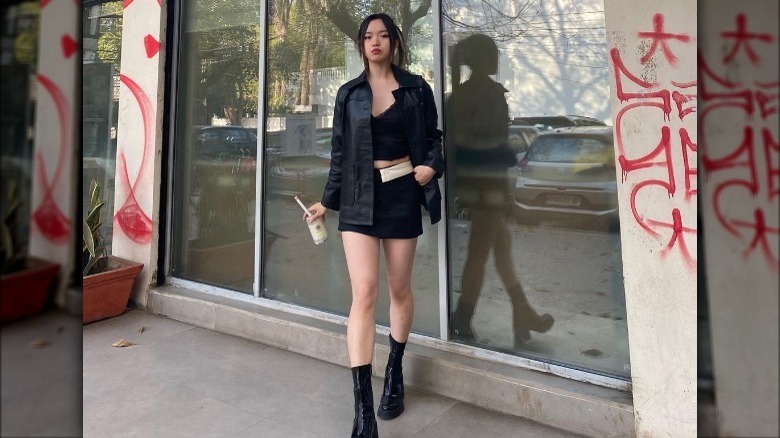 Model wearing black leather jacket