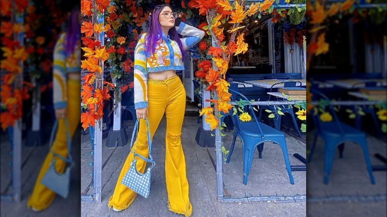 Model wearing bold yellow jeans