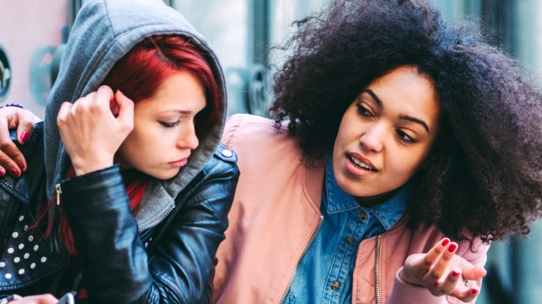 Woman talking to upset partner