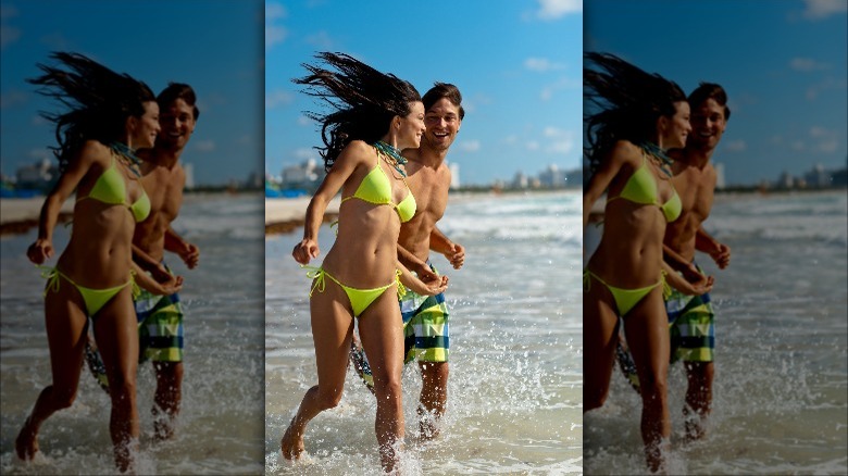 Man, woman in string bikini