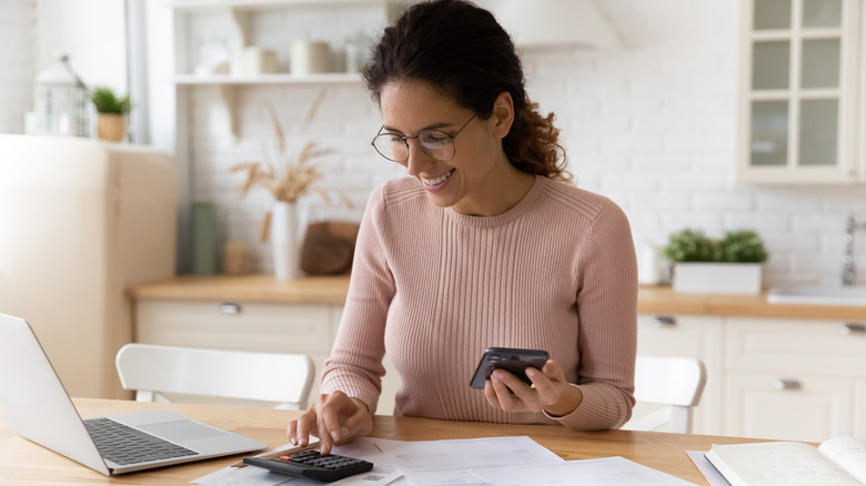 Woman using a calculator