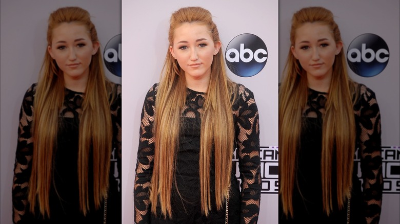 Noah Cyrus with long ginger blond hair