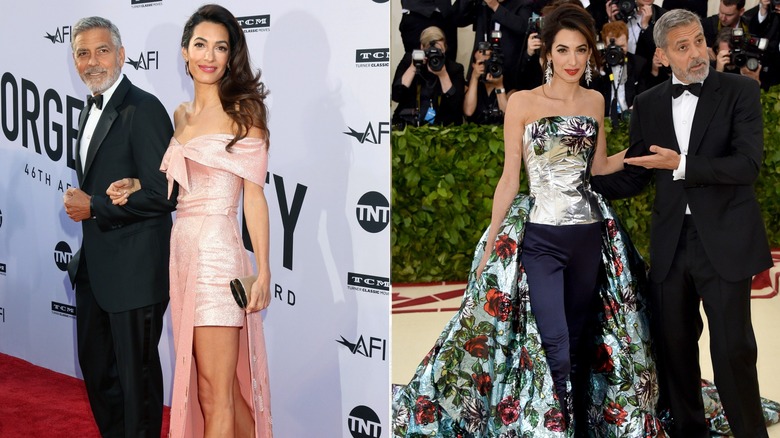 Amal and George Clooney posing on the red carpet