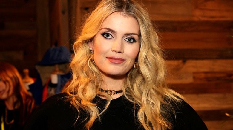 Lady Kitty Spencer wearing a black dress and a Dolce & Gabbana choker.