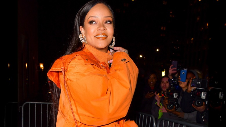 Rihanna in an orange outfit