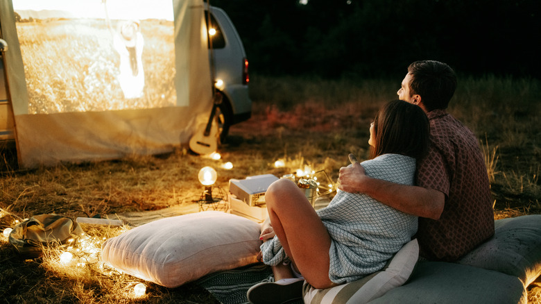 couple enjoying outdoor movie night