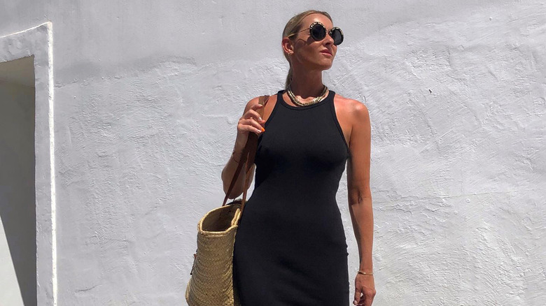 woman in black dress and sunglasses