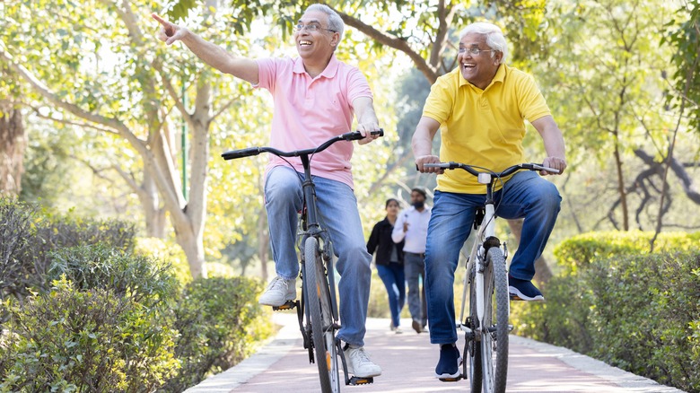 Two people riding bicycles