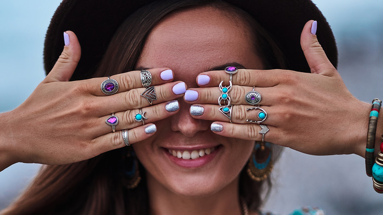 woman wearing stacked rings