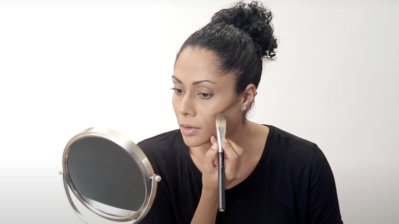 Woman contouring her face