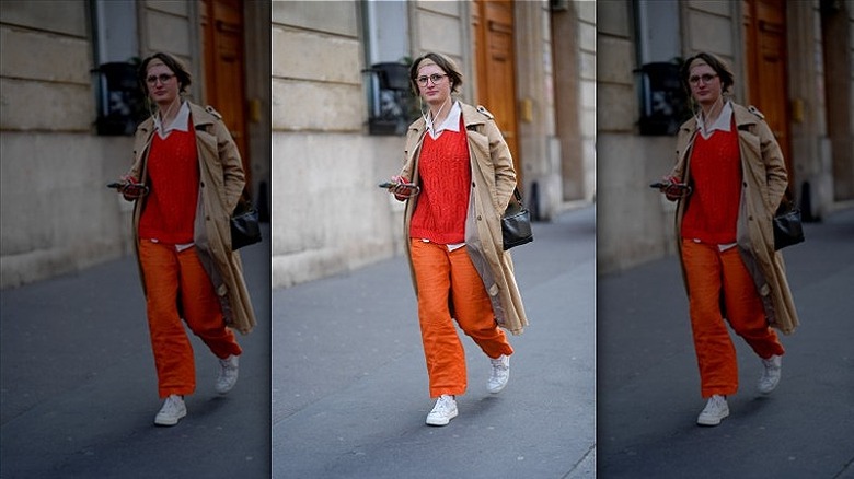 woman wearing red sweater and pants