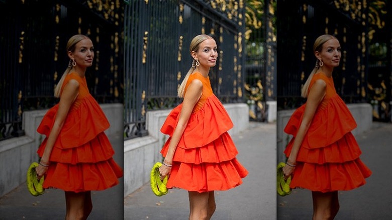 Woman wearing orange and red dress