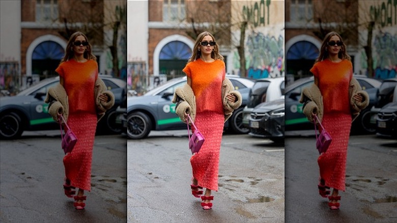 woman wearing top and midi skirt