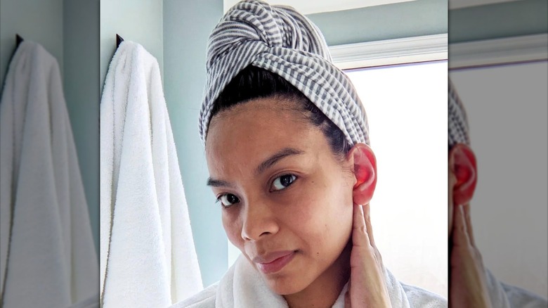 woman with hair wrapped in towel