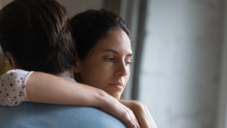 woman hugging man