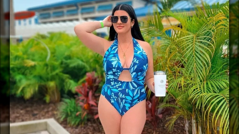 Influencer in blue floral swimsuit