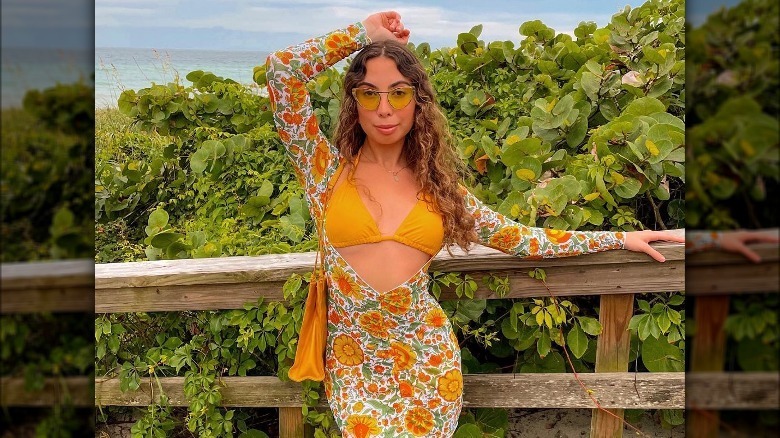 Influencer modeling floral three-piece swimwear