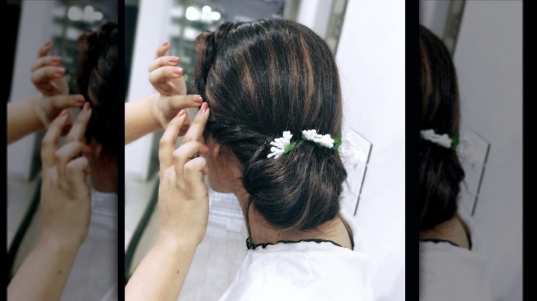 Looped bun with floral embellishments