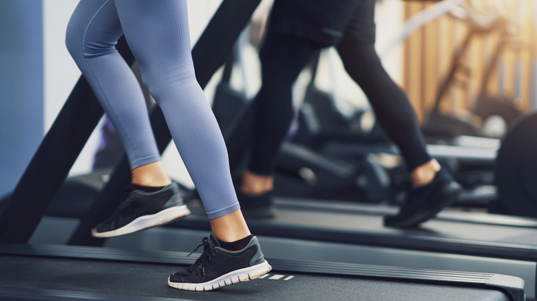 Feet walking on treadmills