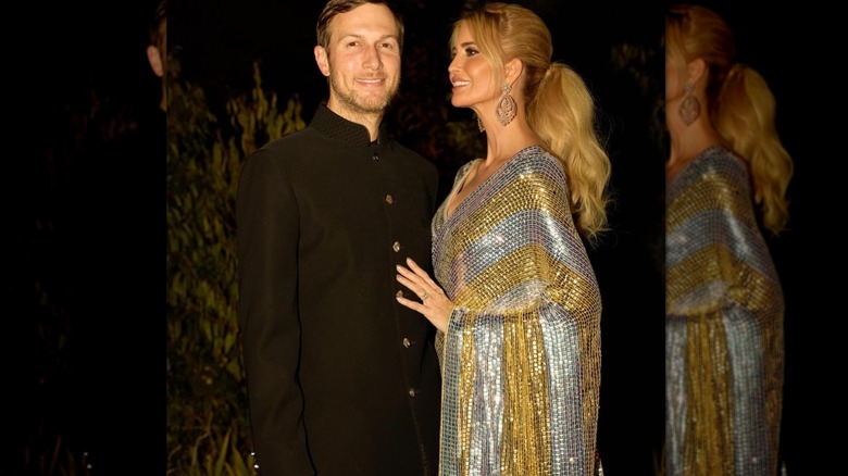 Ivanka Trump with her husband in a sparkly gold and silver dress