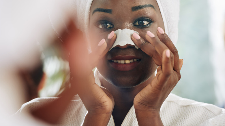 Woman with pore strip on nose