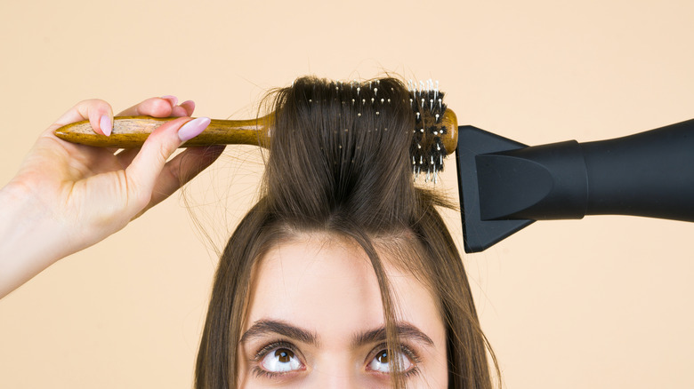 girl styling her hair 