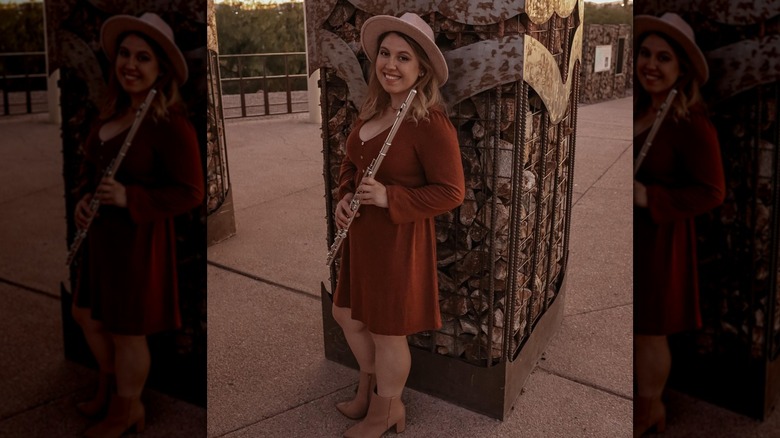 Woman in rust red dress