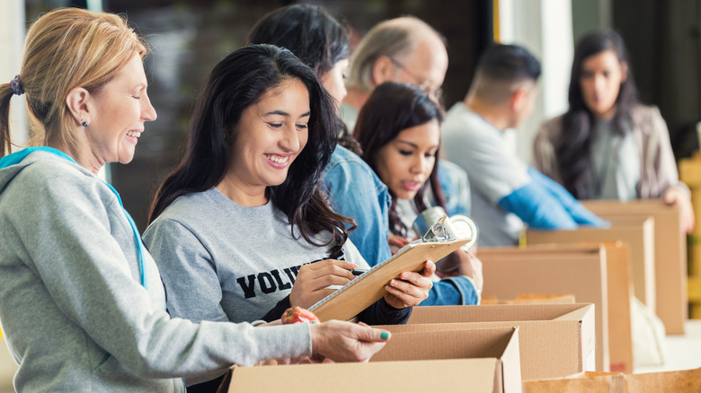 woman volunteering with boxes