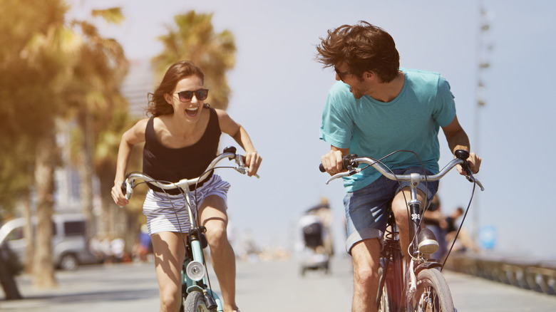 people riding bikes in the sun