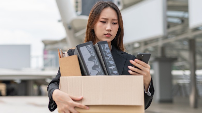 woman carrying box