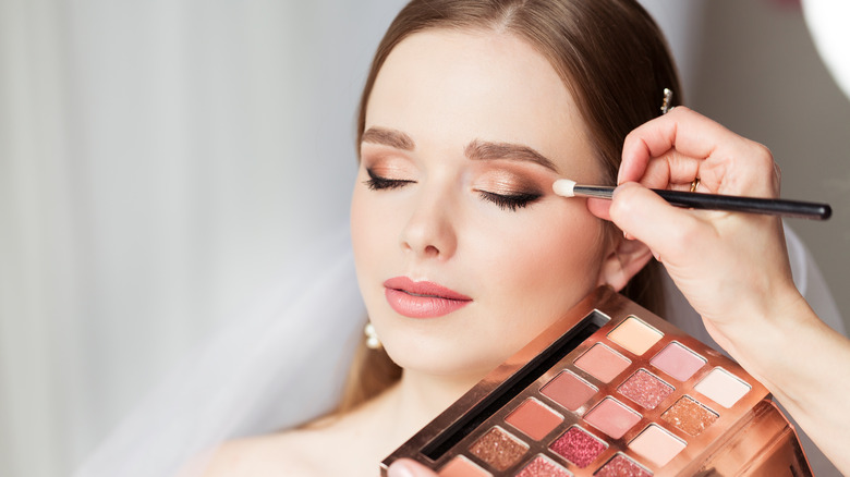 Bride getting her makeup done 