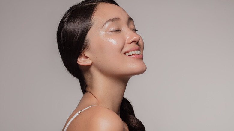 smiling woman with glowing skin