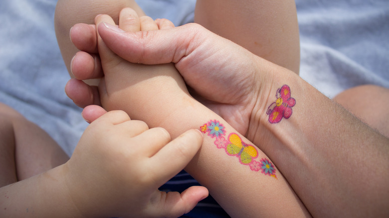 parent and child with press-on tattooes