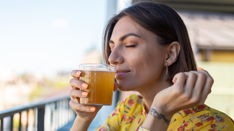 female drinking beer