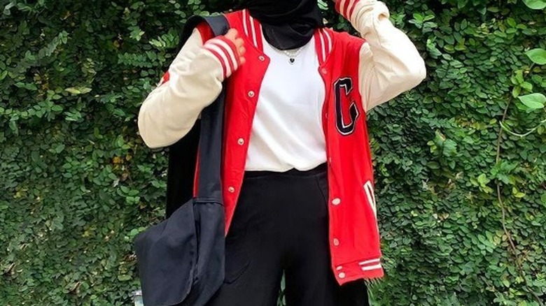 Woman in red varsity jacket