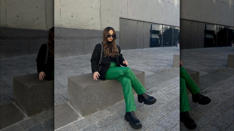 Girl wearing green trousers