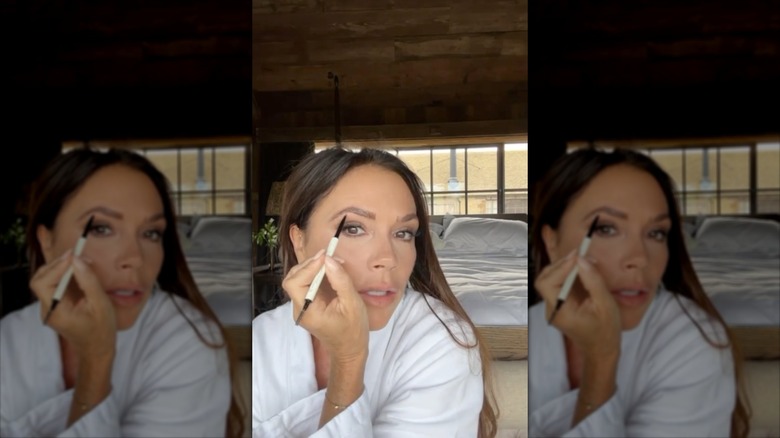 Victoria Beckham drawing on brows