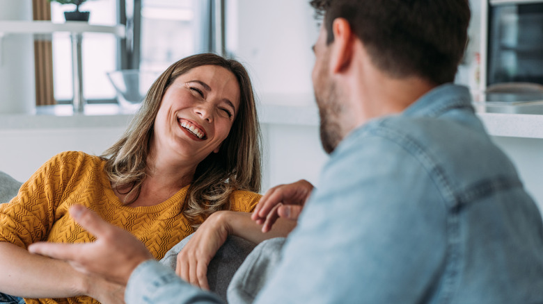 Woman and man talking, laughing