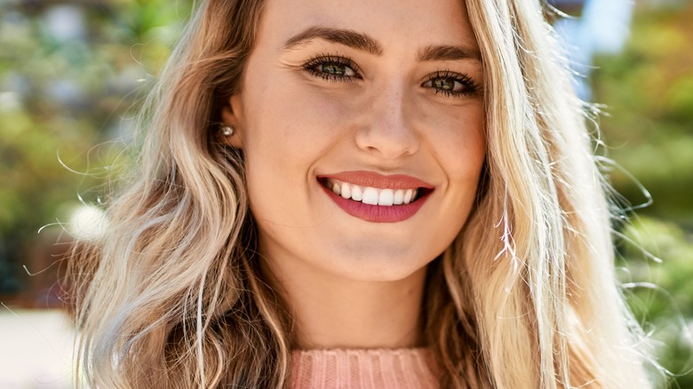 woman outdoors smiling