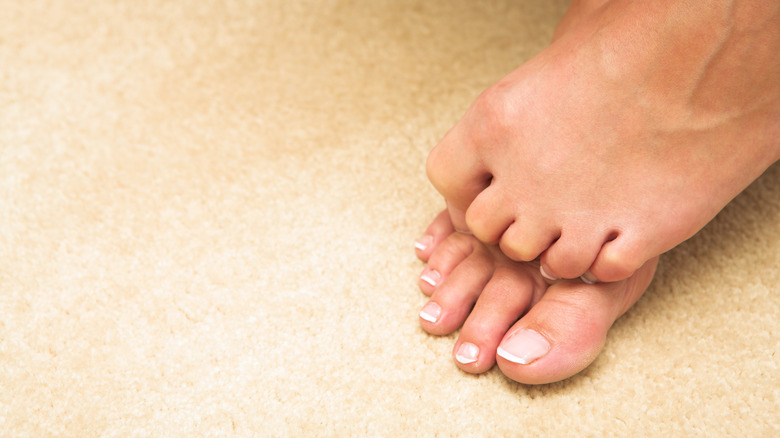 person curling up their toes