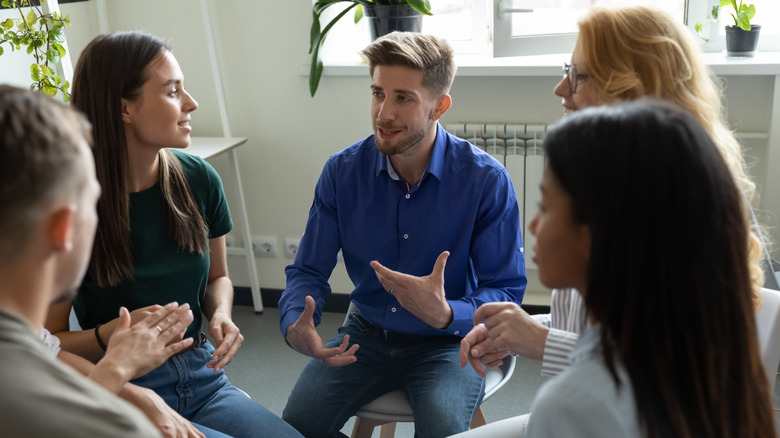 Man talking to therapy support group