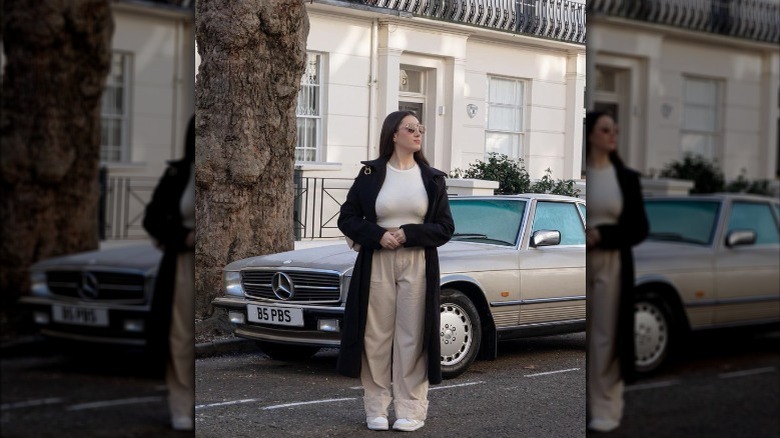 girl wearing beige pants and long coat