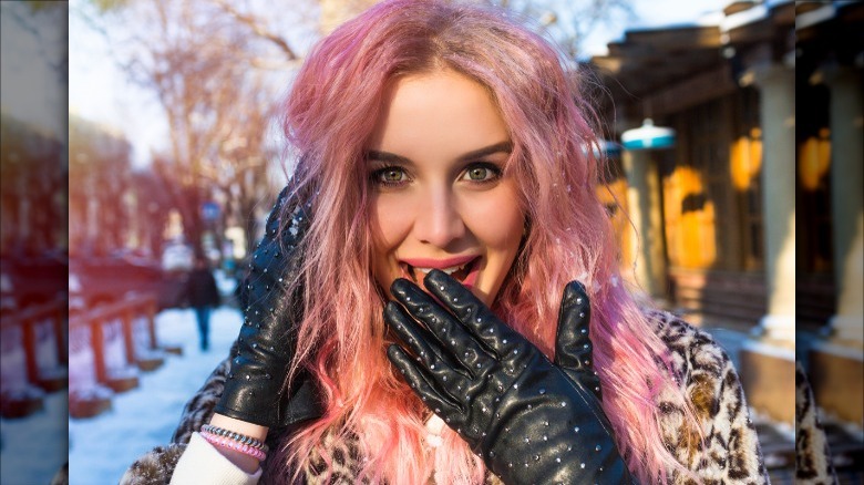 Model with studded black leather gloves