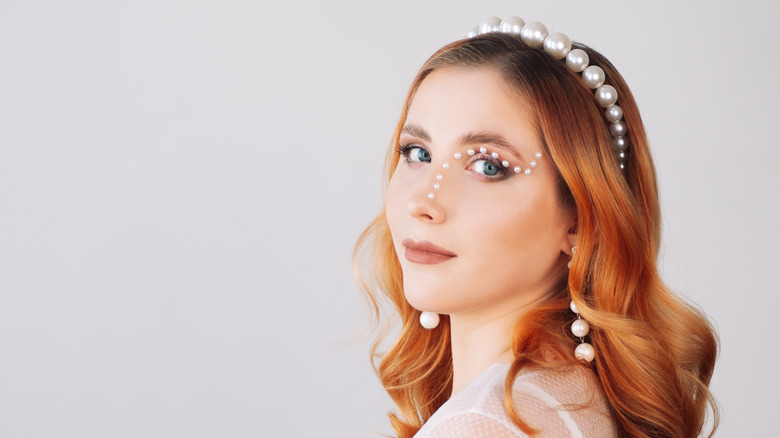 woman in pearl headband