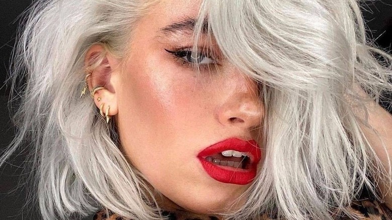 woman with gray hair and red lips