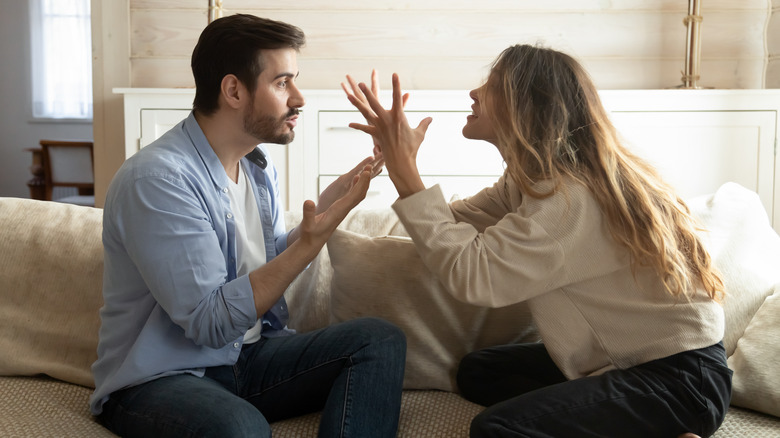 couple arguing in living room