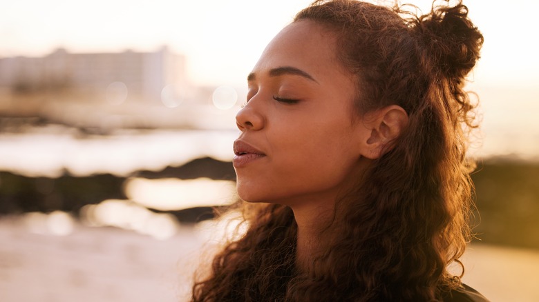 calm woman exhaling