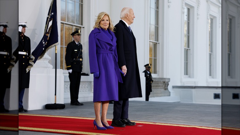 Jill Biden and Joe Biden standing at the White House