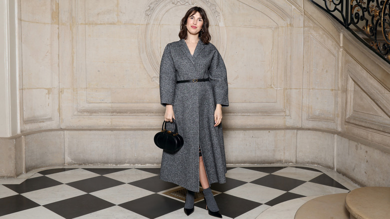 Jeanne Damas wearing a charcoal gray coat at Haute Couture Fashion Week 2025.