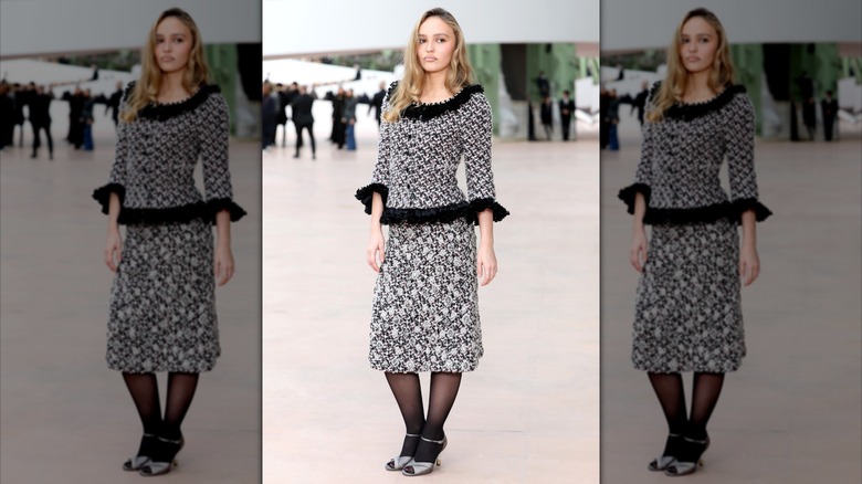 Lily-Rose Depp wearing tweed separates at Haute Couture Fashion Week 2025.